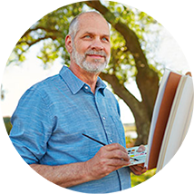 Man posing while painting outdoors