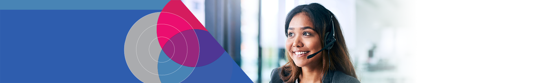 Woman smiling and speaking into a headset